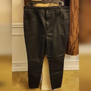 Black straight-leg pants, jeans.
